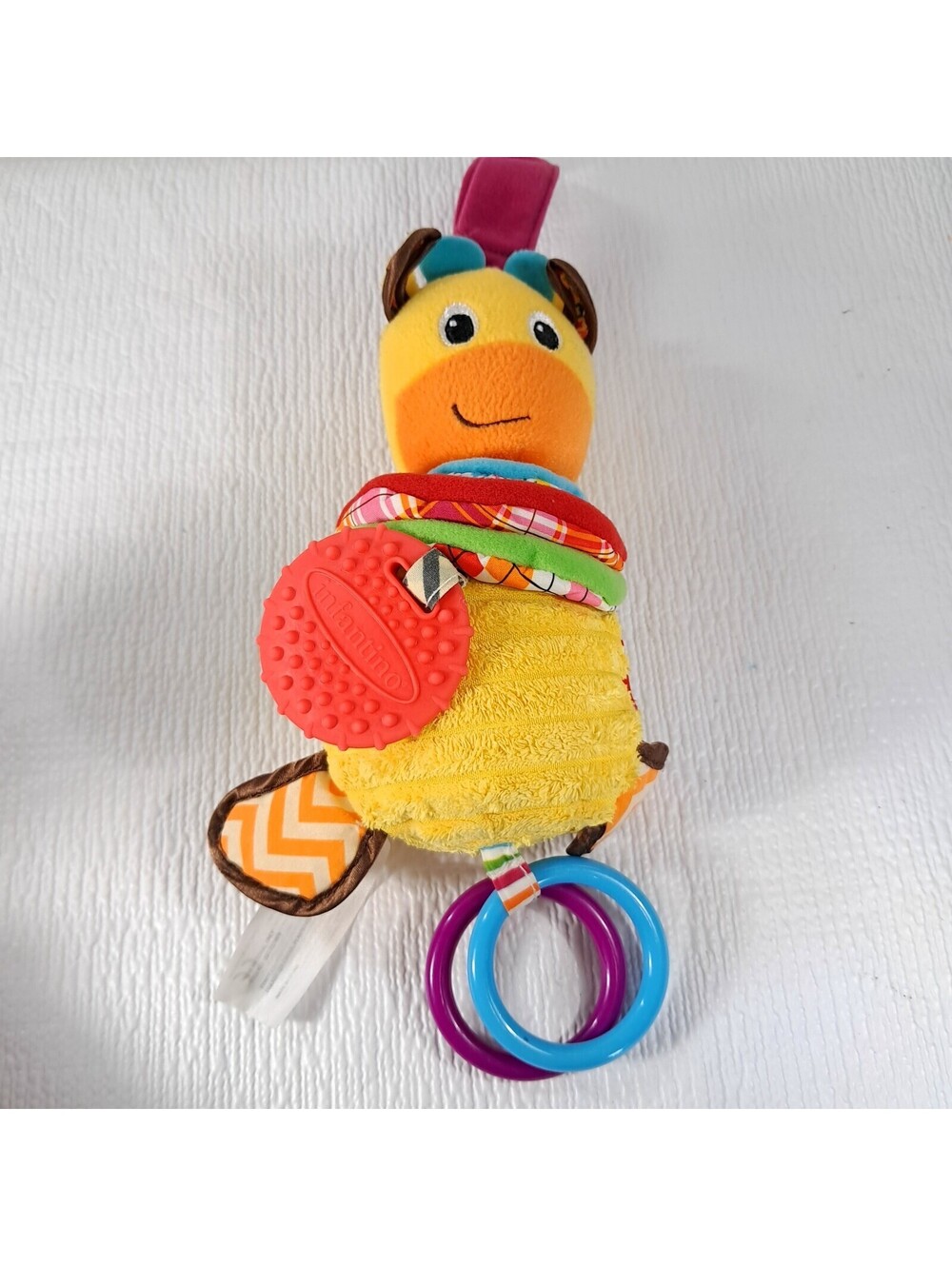 Infantino Hug and Tug Musical Giraffe Baby Plush Toy Crinkle lullaby music soft